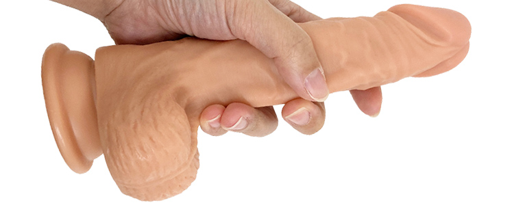 吸盤付きのディルドを持つ画像